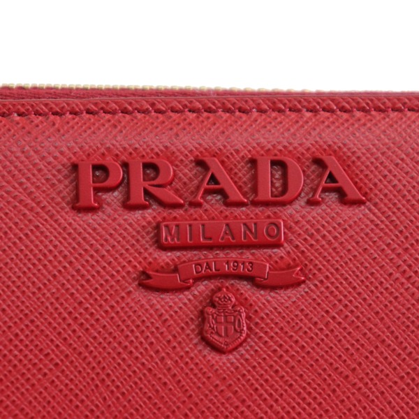 プラダ / PRADA サフィアーノ ラウンドファスナー長　サフィアーノ　レッド　1ML506　　型押しレザー　ファスナー長 ラウンドファスナー長財布  レッド(FUOCO)/ゴールド金具 1ML506 型押しカーフレザー レディース 財布 【未使用】【purse】